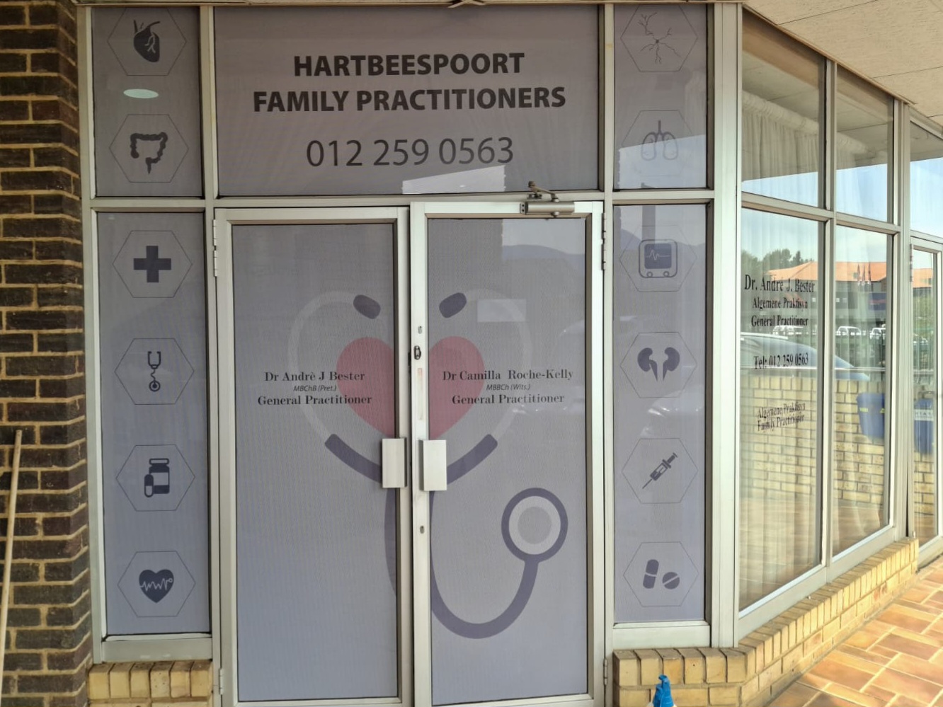 Hartbeespoort Family Practitioners medical window frosting with icons and doctor names