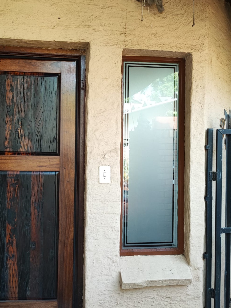 Decorative window frosting film applied to glass door and panels